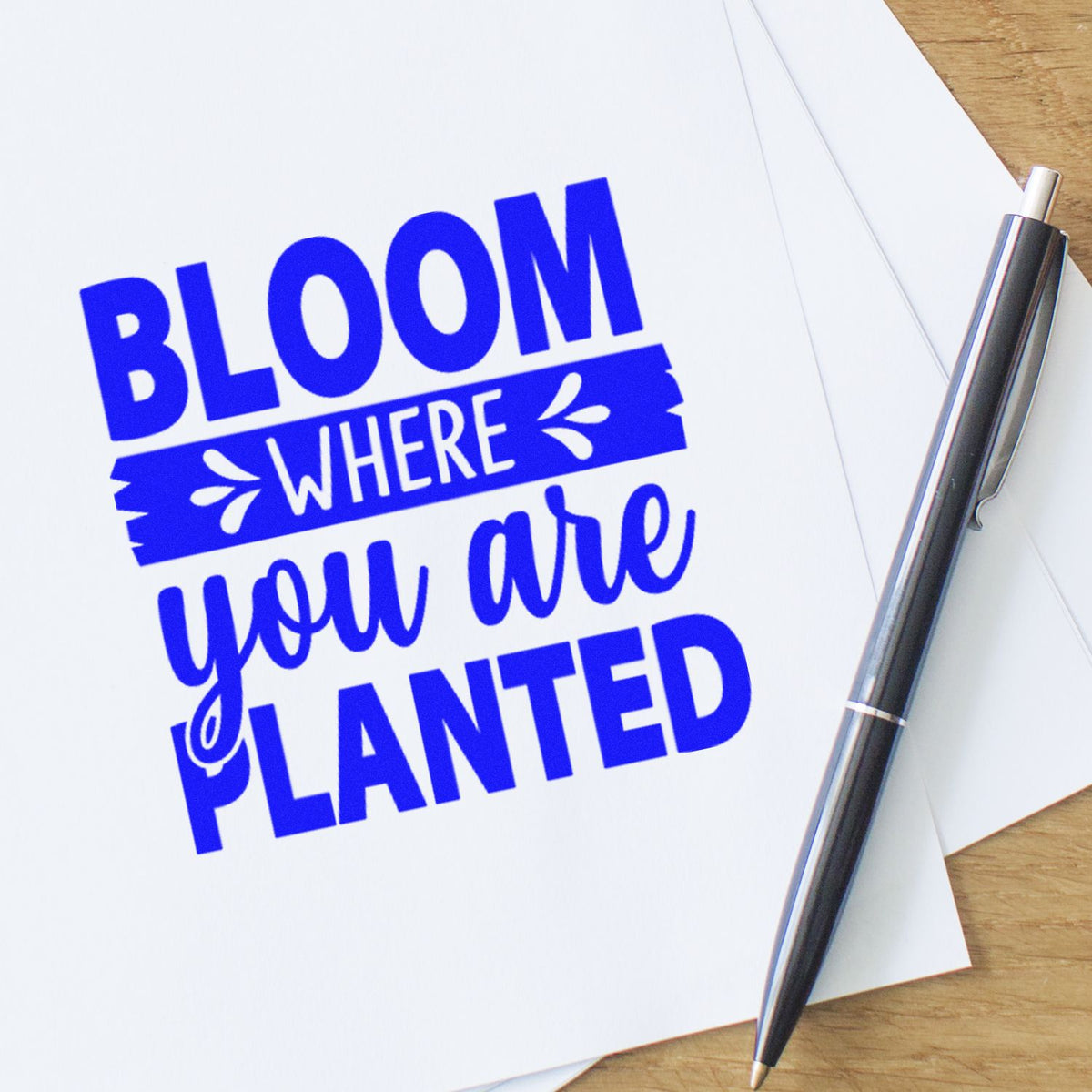 Custom rubber stamp reading Bloom where you are planted for inspirational crafts, planners, and handmade gifts.