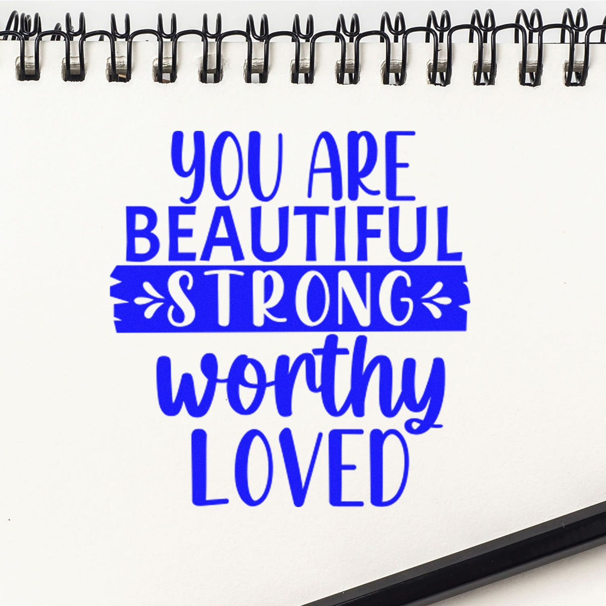 Inspirational rubber stamp with blue affirmation text: You are beautiful, strong, worthy, loved for journaling and crafting.