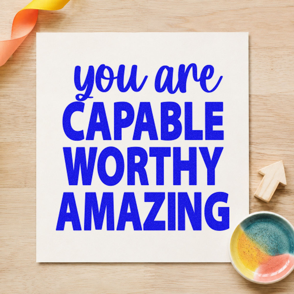 Capable Worthy Amazing Lettering craft stamp imprinted in blue ink on paper, a design suited to framed study desk.
