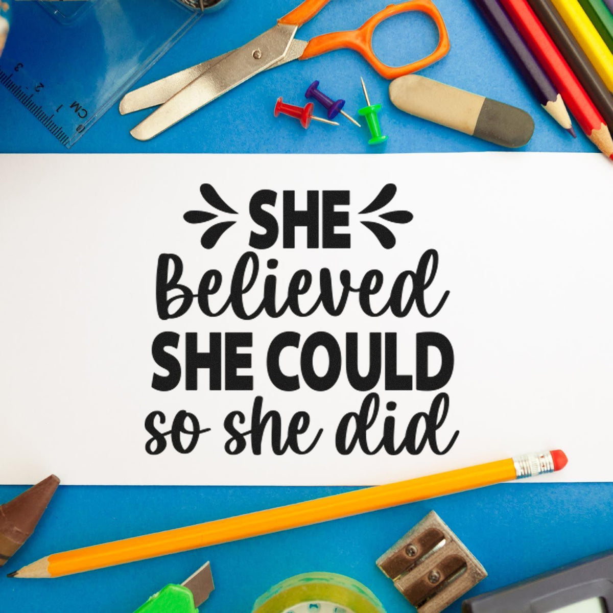 Custom motivational rubber stamp imprint reading She believed she could so she did, with colorful school supplies.