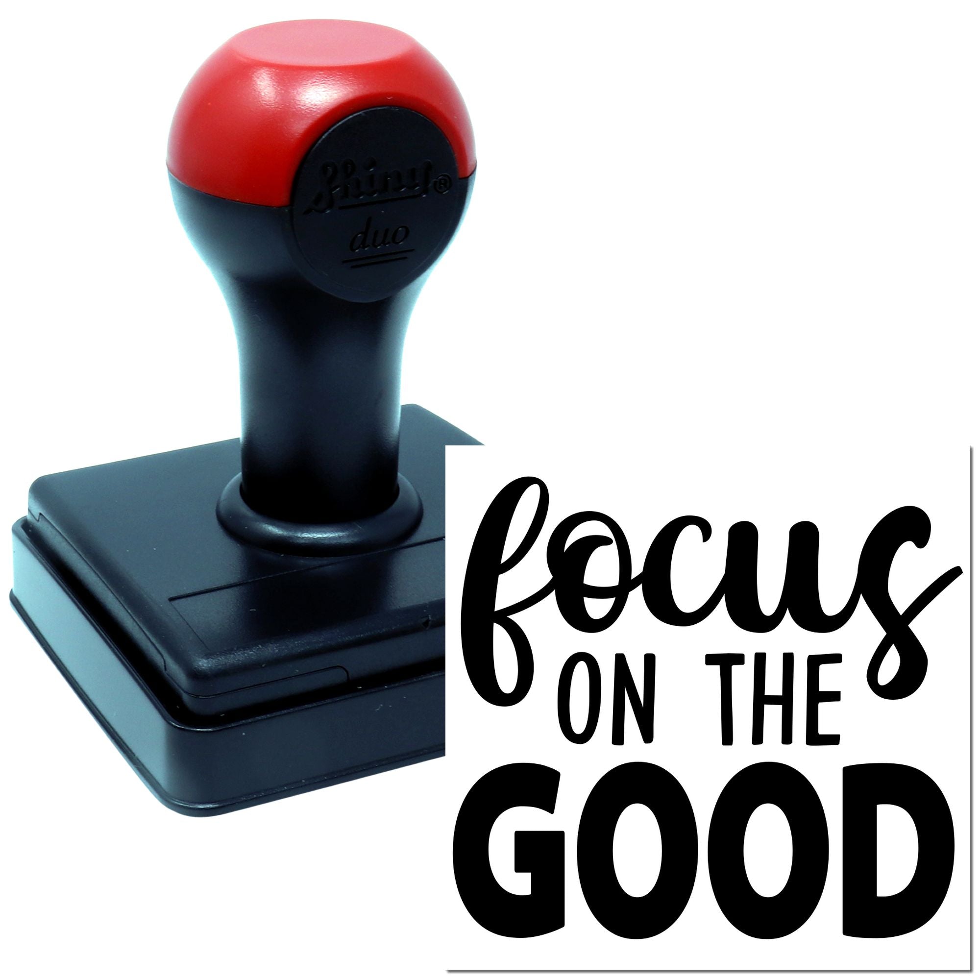 Self-inking rubber stamp with red and black handle, printing focus on the good motivational message.