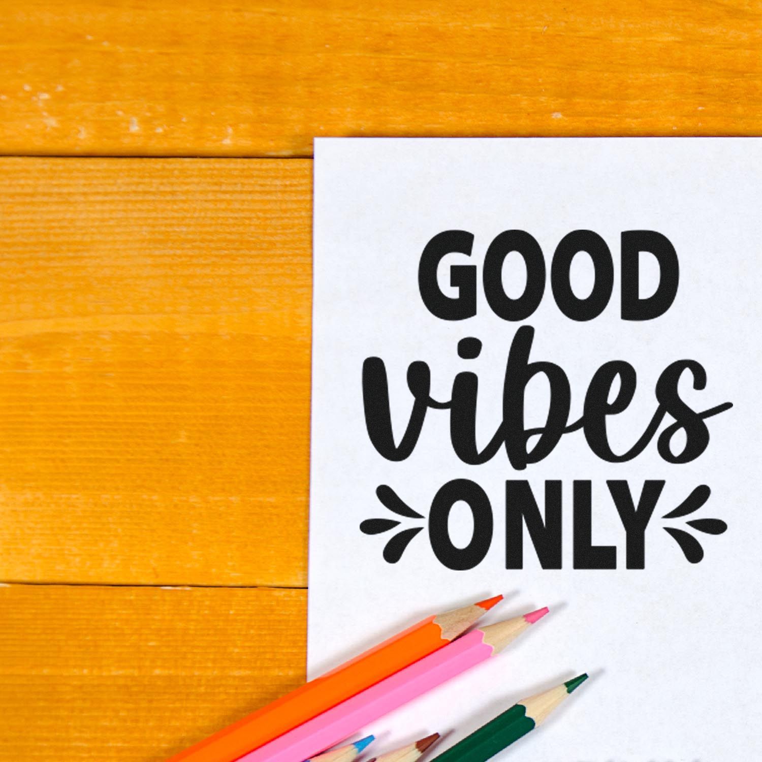 Good vibes only rubber stamp design for positive craft projects, shown on white paper with colored pencils.