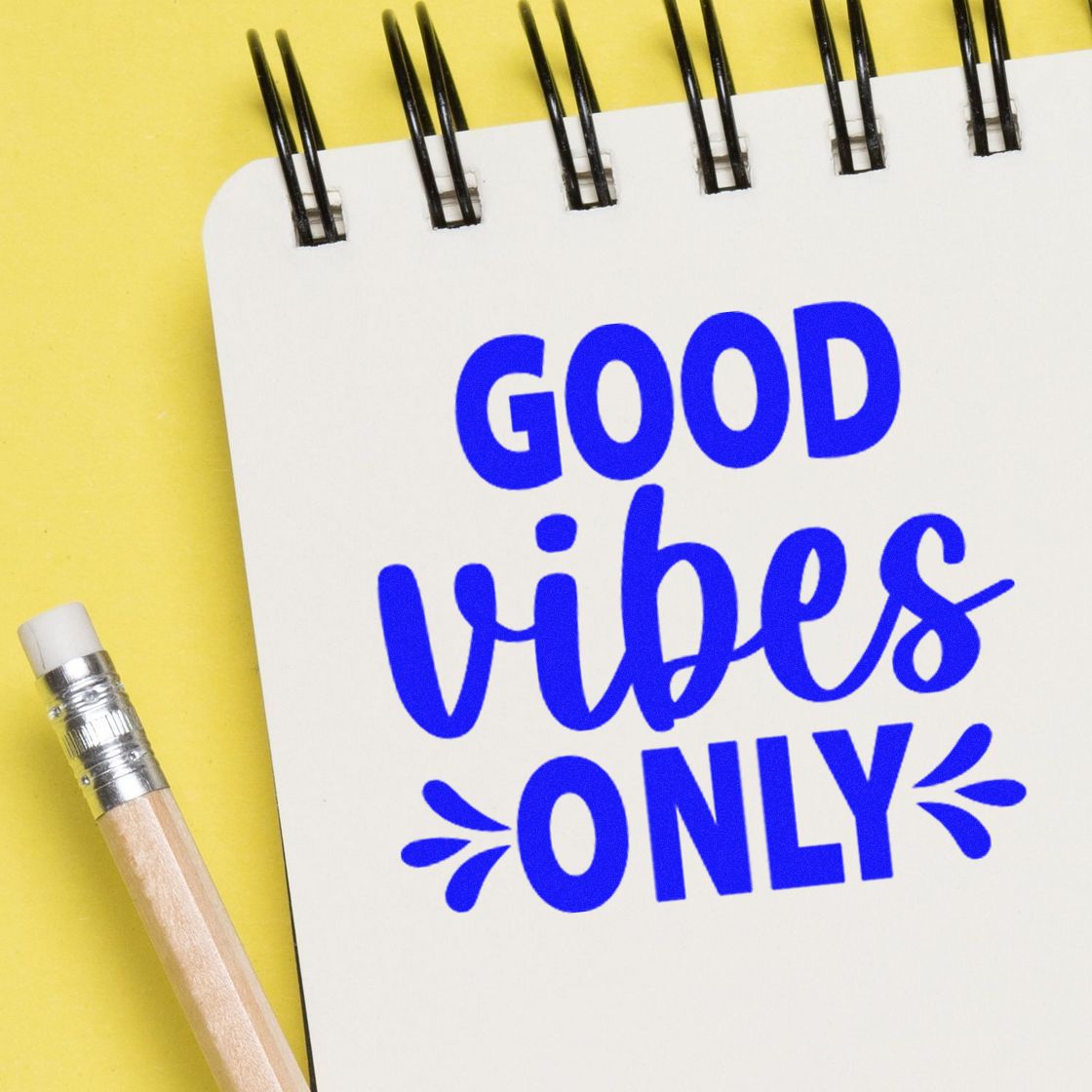 Good Vibes Only custom rubber stamp on notebook, ideal for planners, crafts, and positive branding.