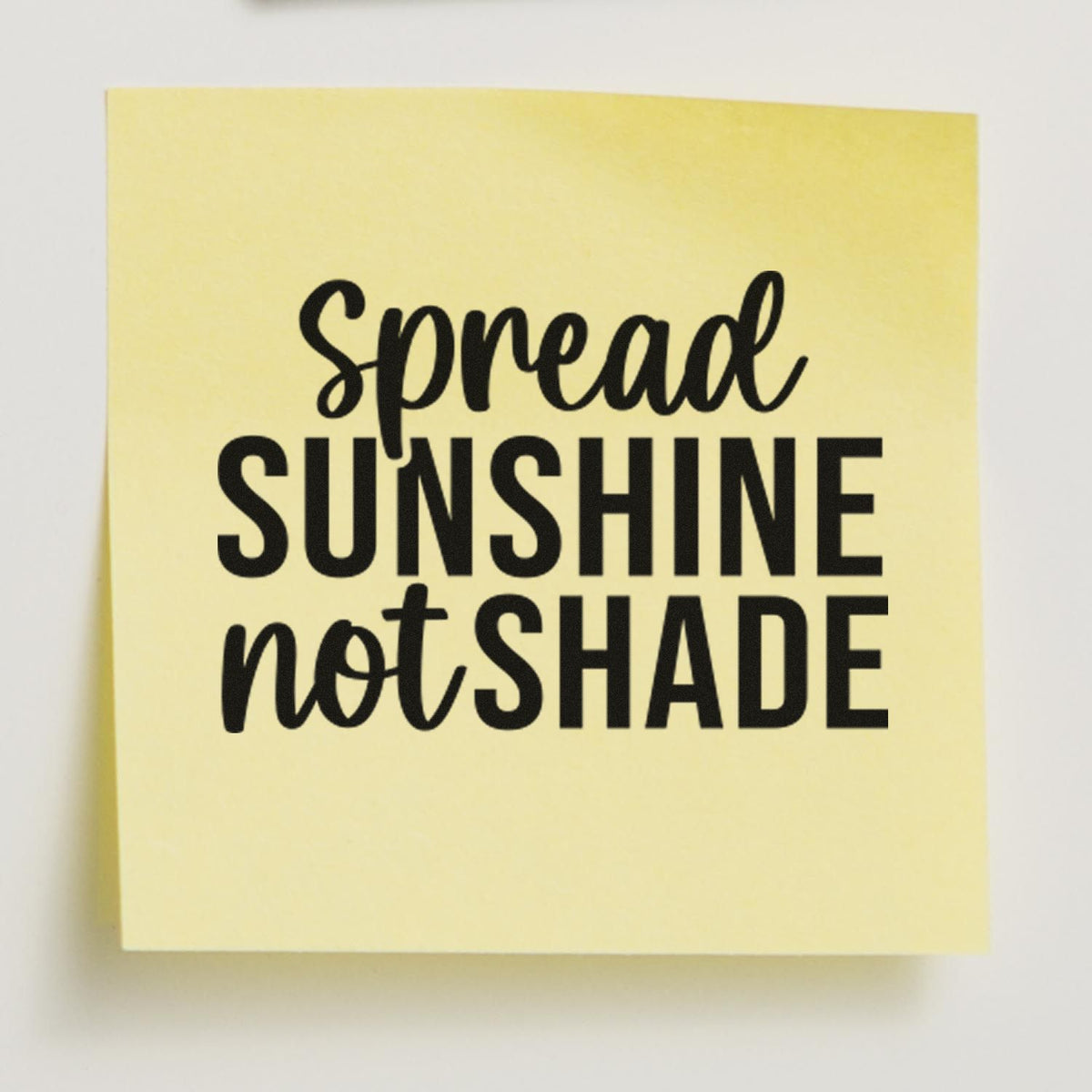 Spread Sunshine Not Shade motivational rubber stamp on a yellow note, perfect for uplifting craft and office projects.