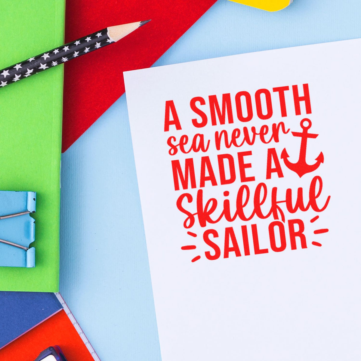 Nautical rubber stamp design with quote A smooth sea never made a skillful sailor and anchor graphic.