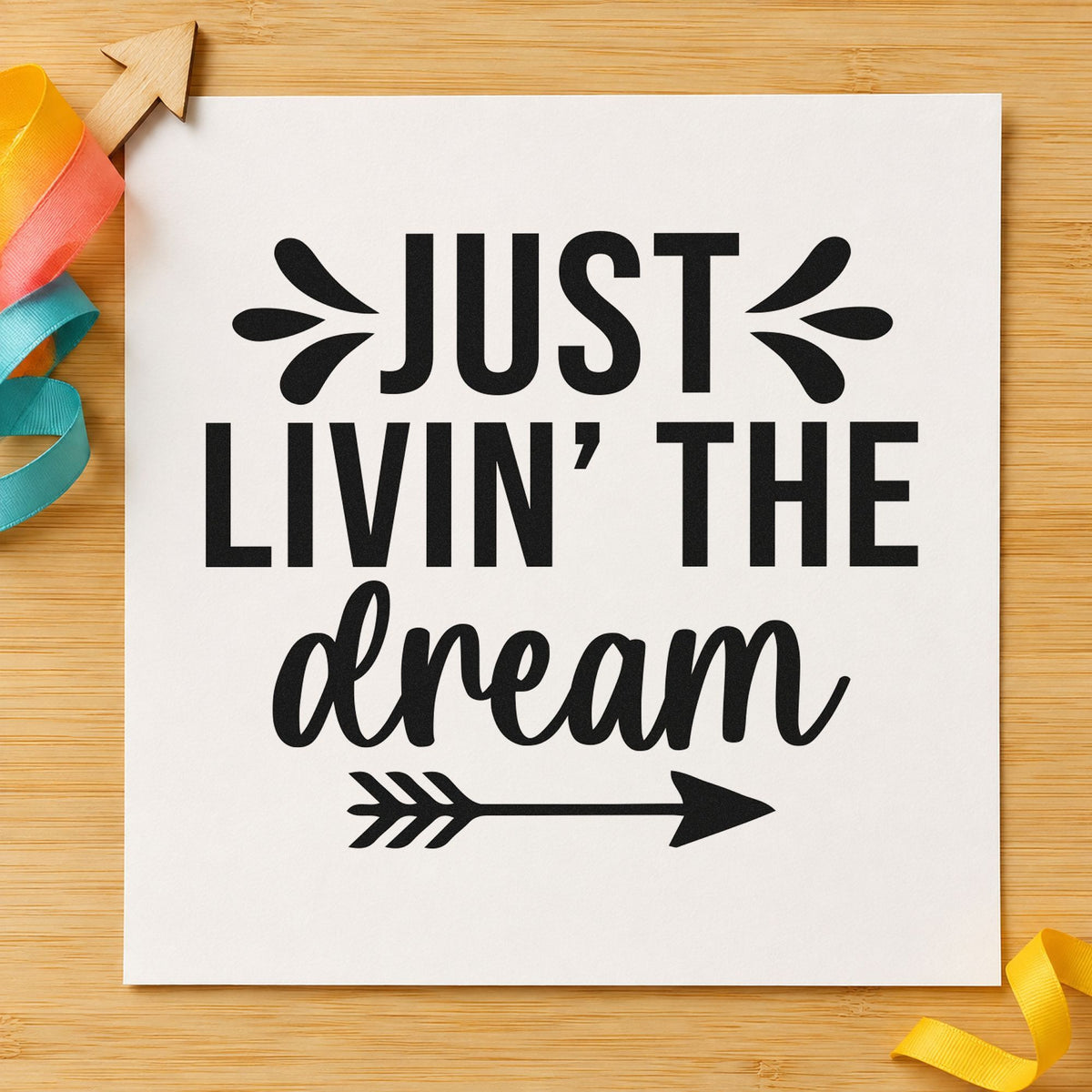 Just Livin The Dream craft stamp imprint in black ink on a handmade project, one idea being trade gift tags.