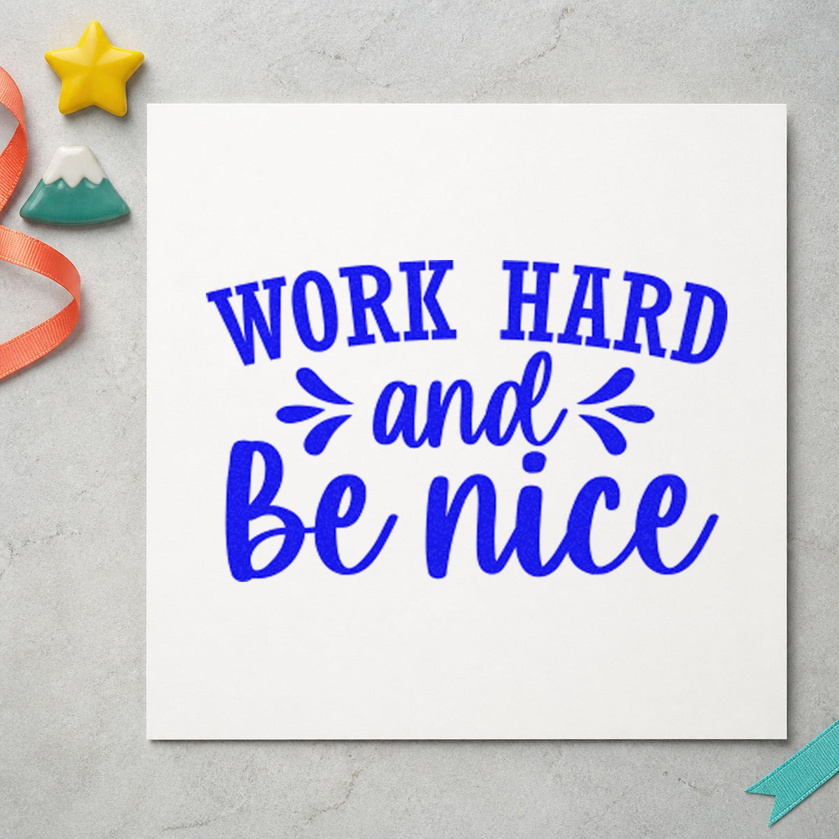 Work Hard And Be Nice craft stamp in blue ink on cardstock, an easy option for crew shirt printing.