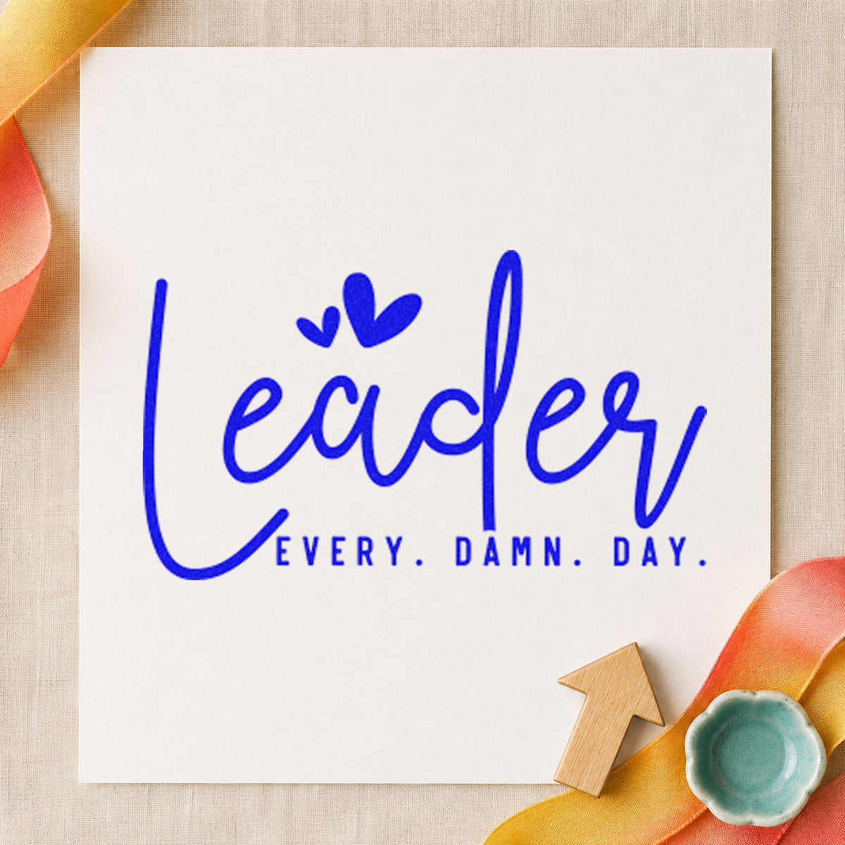 Leader Every Damn Day craft stamp in blue ink on cardstock, an easy option for staff vest printing.