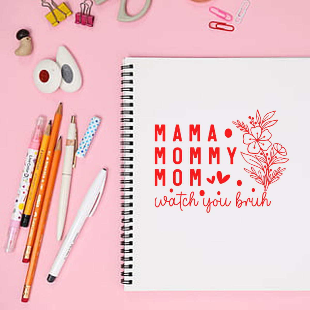 Custom MAMA MOMMY MOM floral rubber stamp design mockup on notebook for mom scrapbook, planner, and craft stamping.