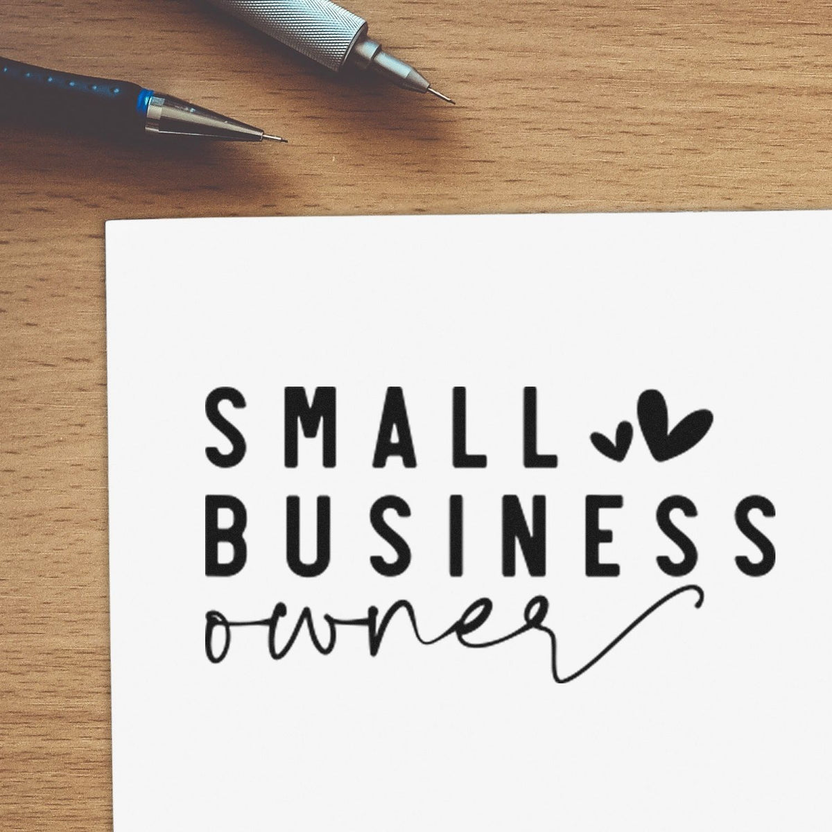 Small business owner rubber stamp design on paper, ideal for custom branding, packaging, and handmade business marketing.