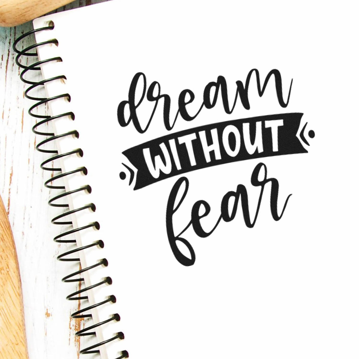 Dream without fear inspirational rubber stamp design on a spiral notebook page