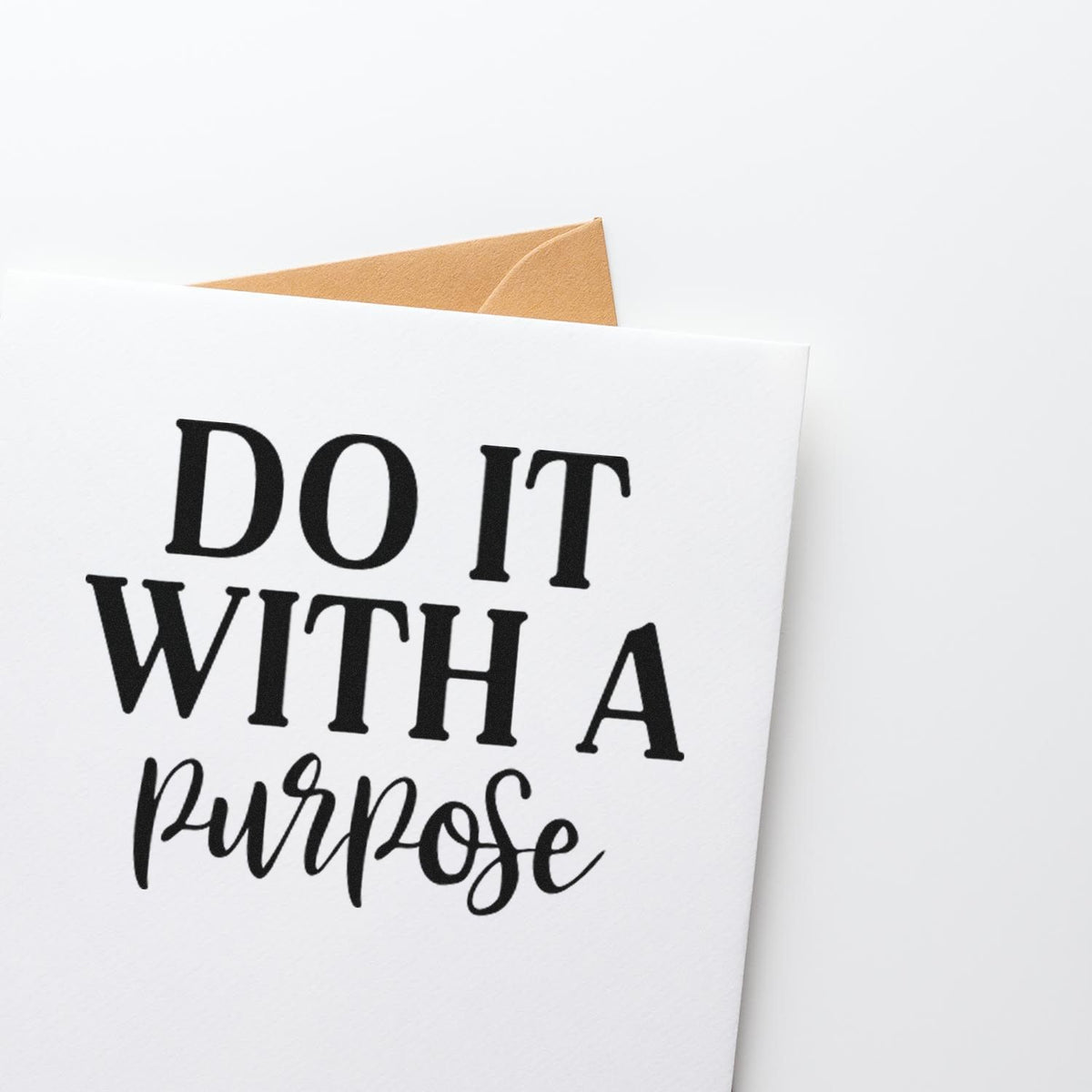 Custom rubber stamp design reading Do It With a Purpose on white card, ideal for motivational stationery and handmade packaging.