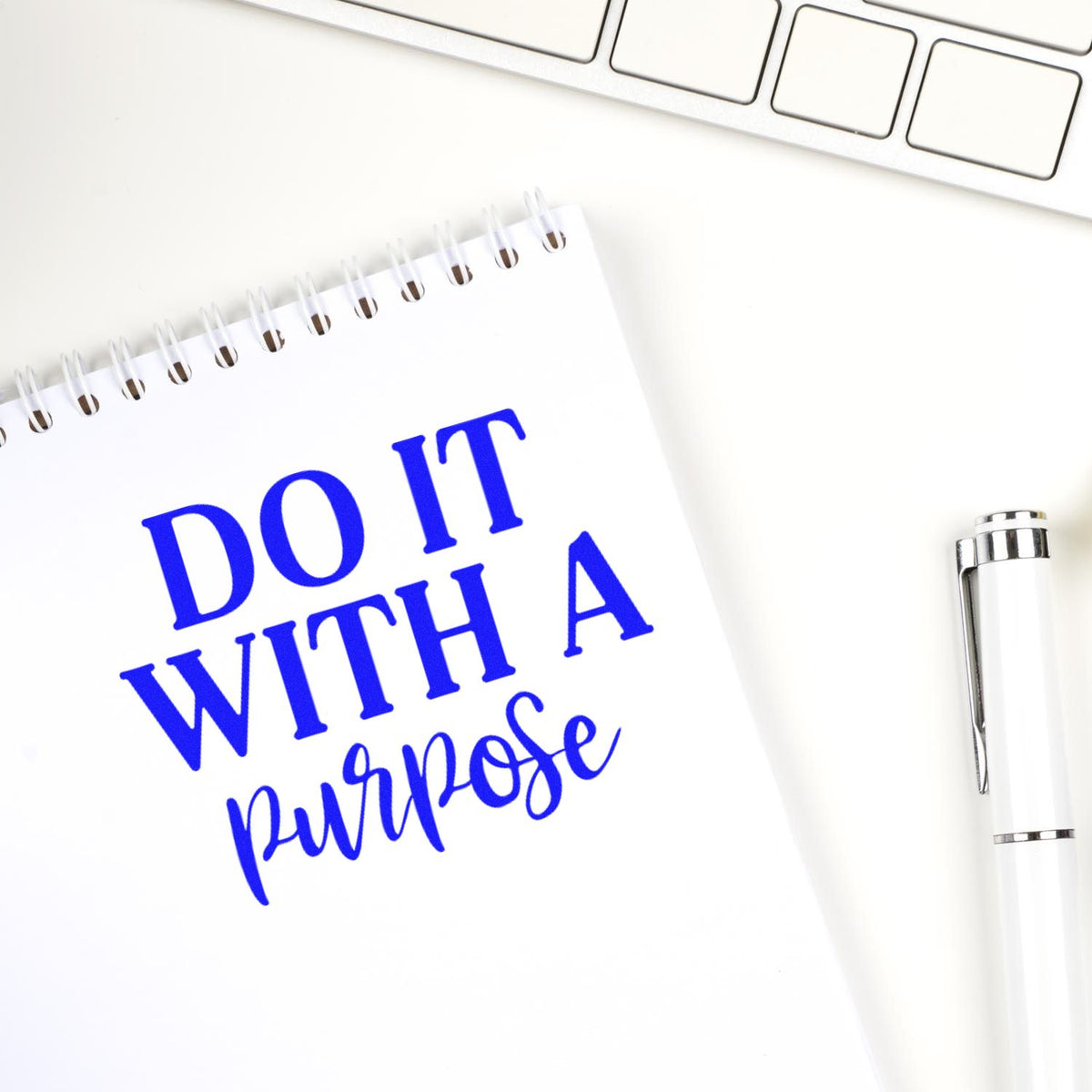 Motivational rubber stamp imprint reading Do It With a Purpose on a notebook, ideal for custom office and craft stamps.