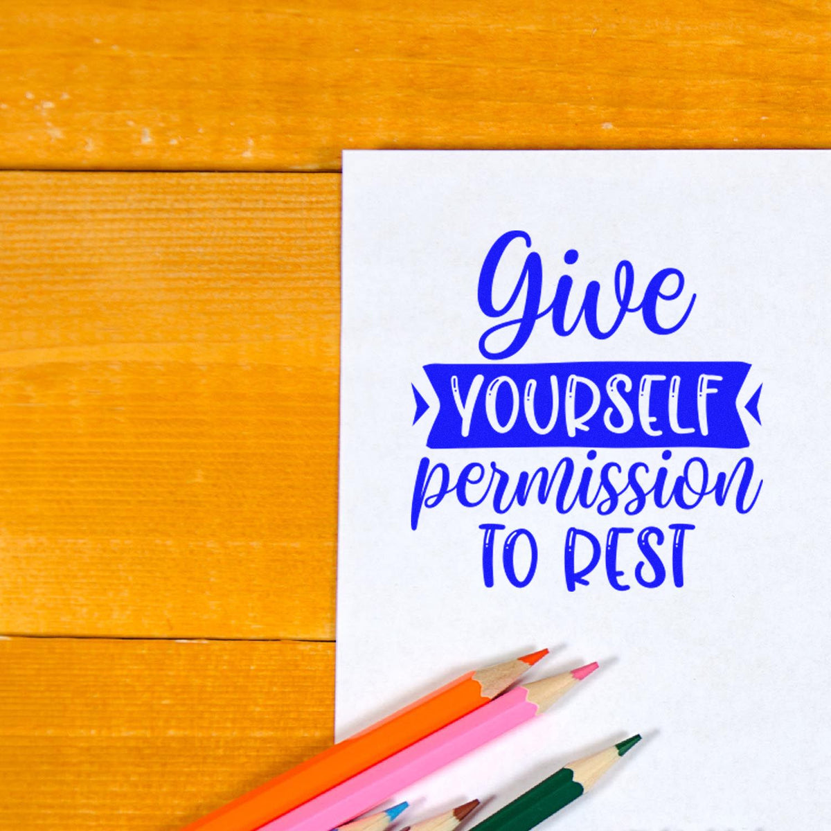 Give Yourself Permission To Rest rubber stamp shown in blue ink, stamped for projects such as slow day album page.