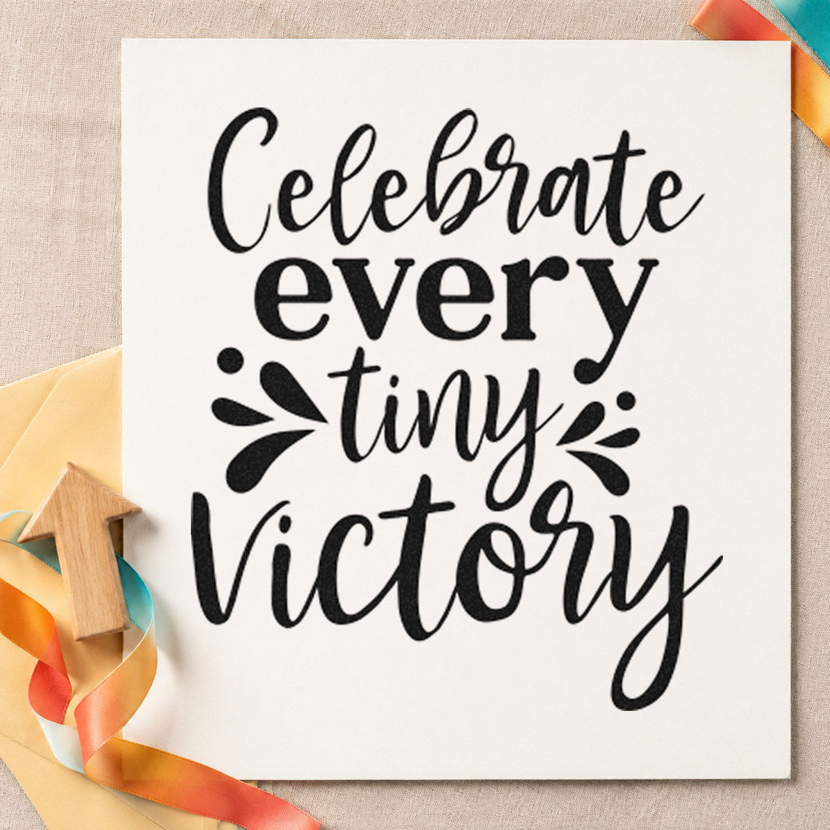 Celebrate Every Tiny Victory craft stamp imprint in black ink on a handmade project, one idea being donate box gift tags.