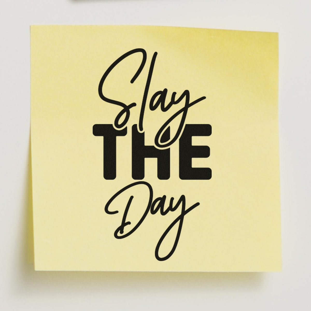 Motivational rubber stamp design reading Slay THE Day on a yellow note, ideal for planners, crafts, and stamping projects.