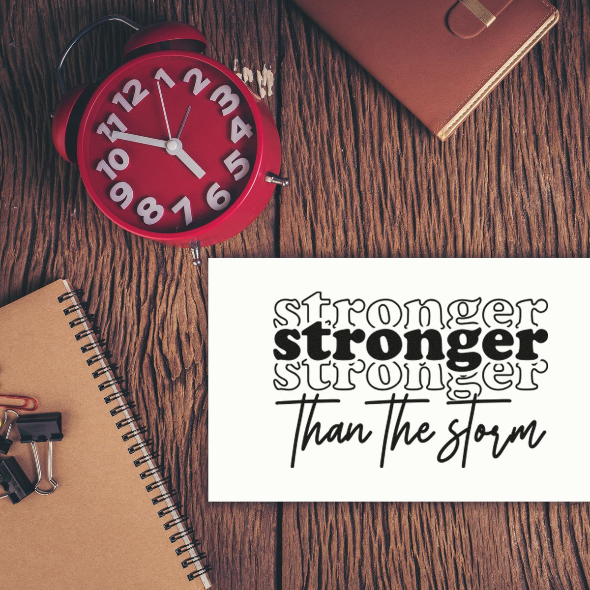 Motivational rubber stamp design with quote Stronger than the storm for resilience, crafting, and journaling.