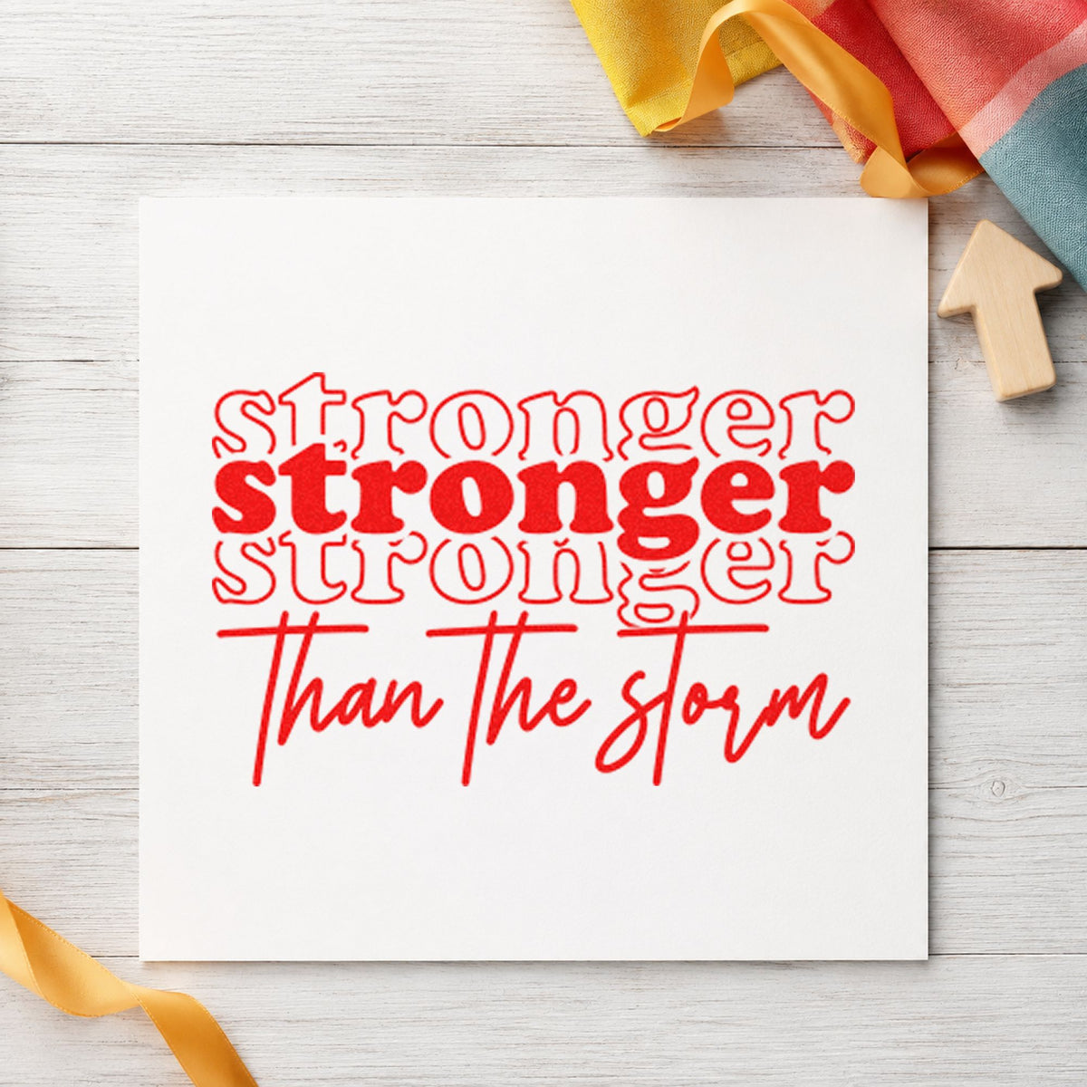 Stronger Than The Storm Repeated craft stamp imprint in red ink on a handmade project, one idea being weight check cards.
