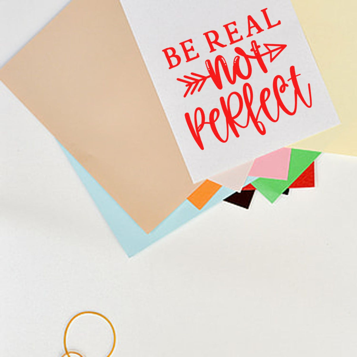 Custom rubber stamp with Be Real, Not Perfect red lettering for stationery, journaling, and craft projects.