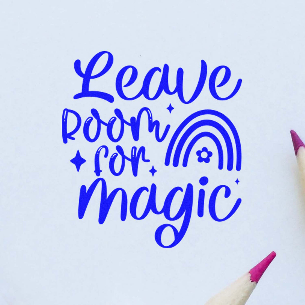 Blue rubber stamp design with Leave Room for Magic text, rainbow, and stars on white paper.