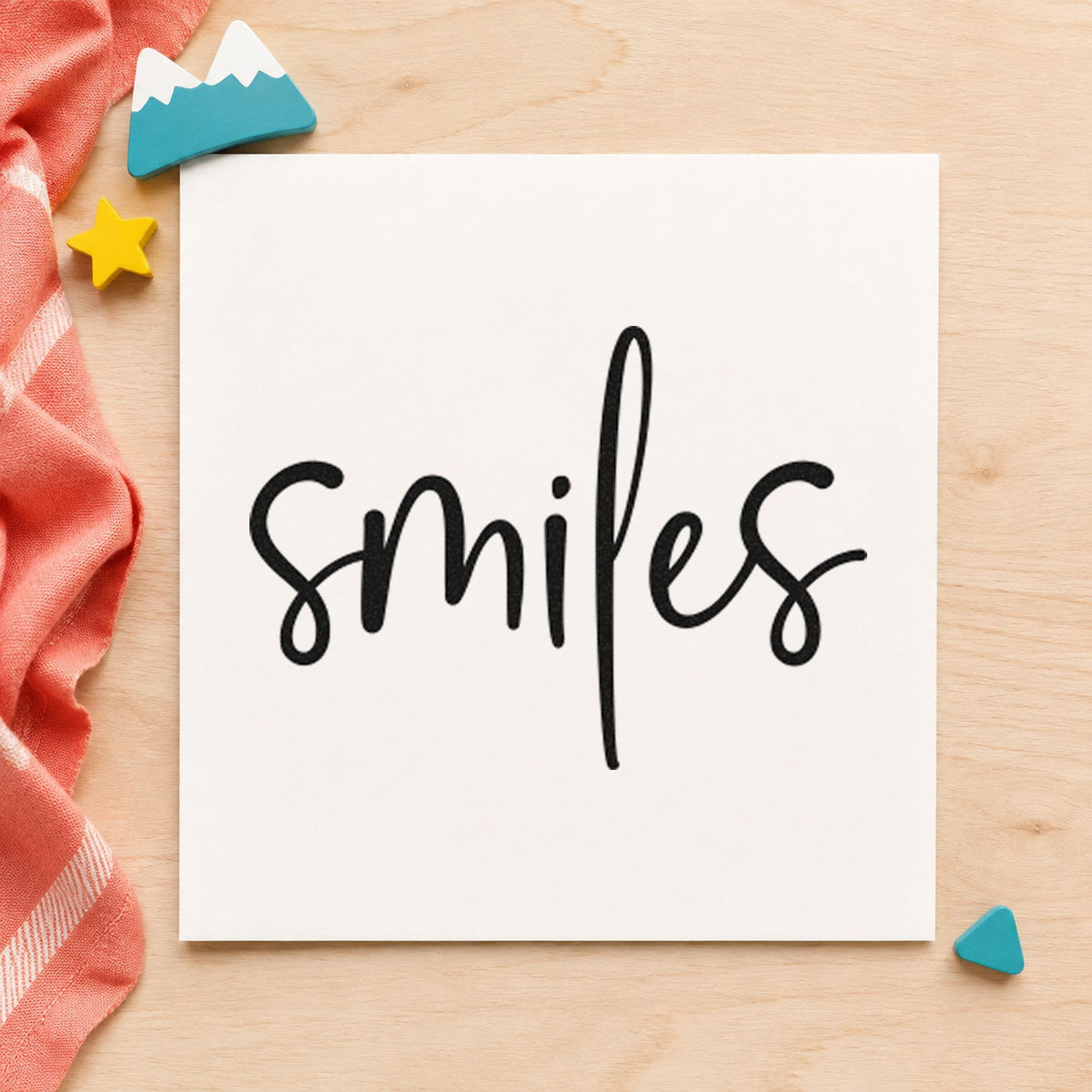 Smiles Simple Brush Script rubber stamp printed in black ink, ready for event book sheet and similar paper crafts.