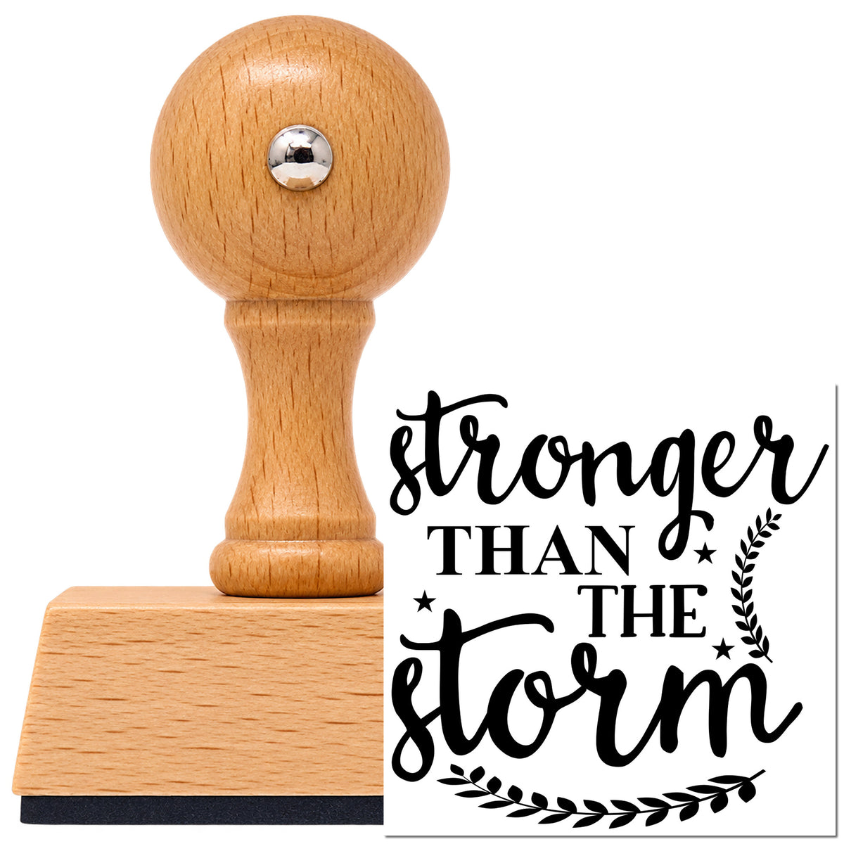 Stronger Than The Storm Leaves Vintage Pro rubber stamp in European beech wood with a round knob handle, shown beside its black imprint.