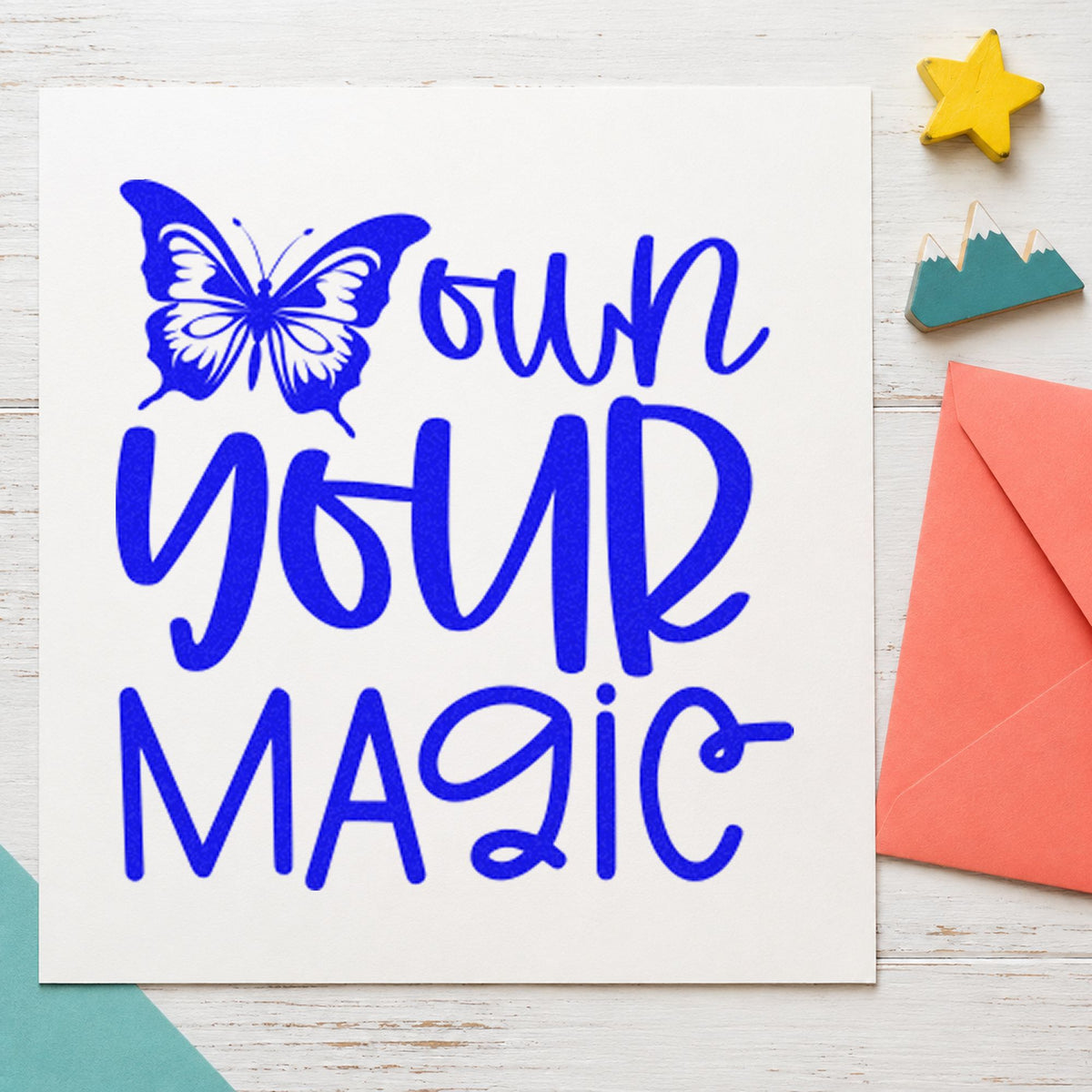 Own Your Magic Butterfly craft stamp in blue ink on cardstock, an easy option for smock panel printing.