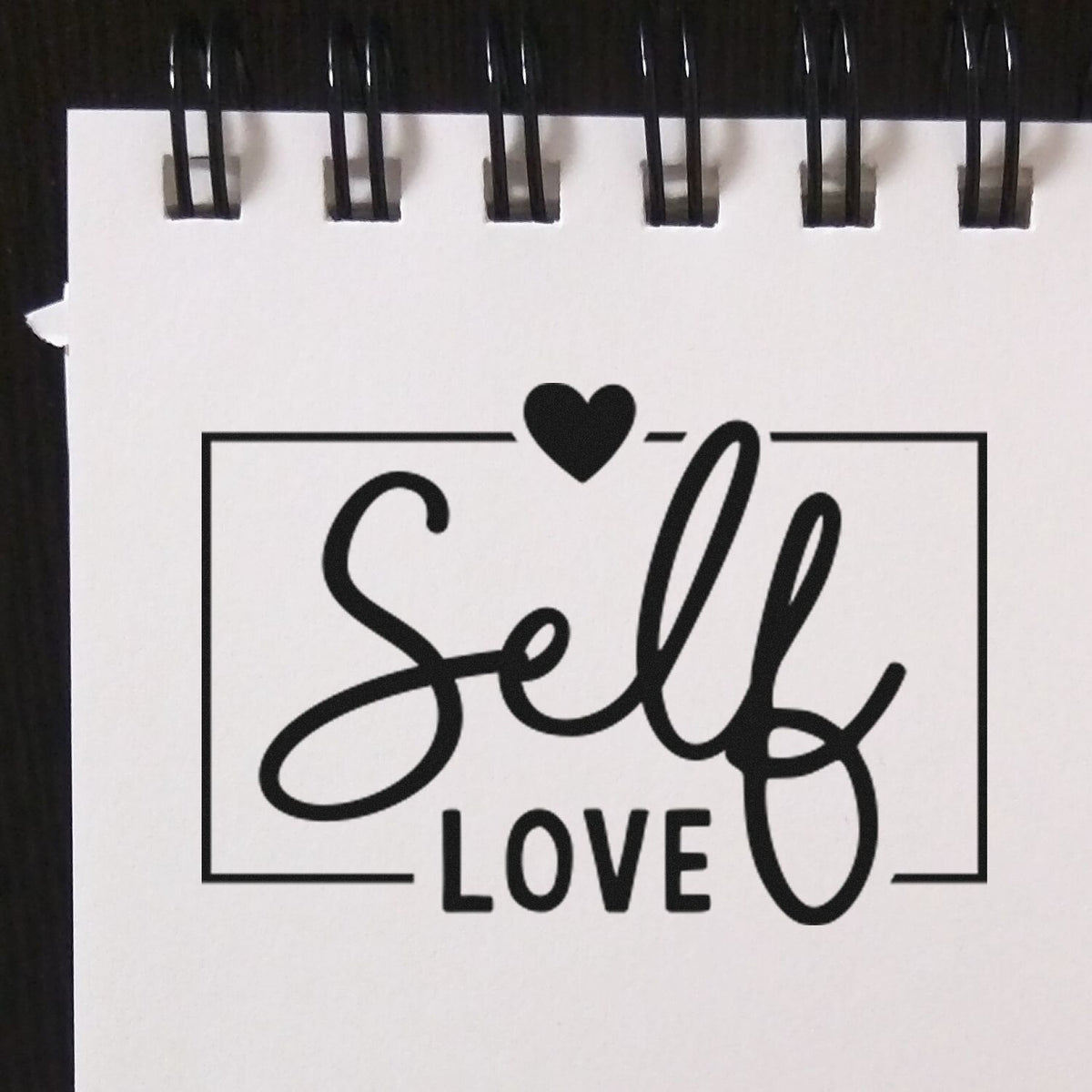 Self Love rubber stamp design with heart, ideal for journaling, planners, and handmade craft projects.