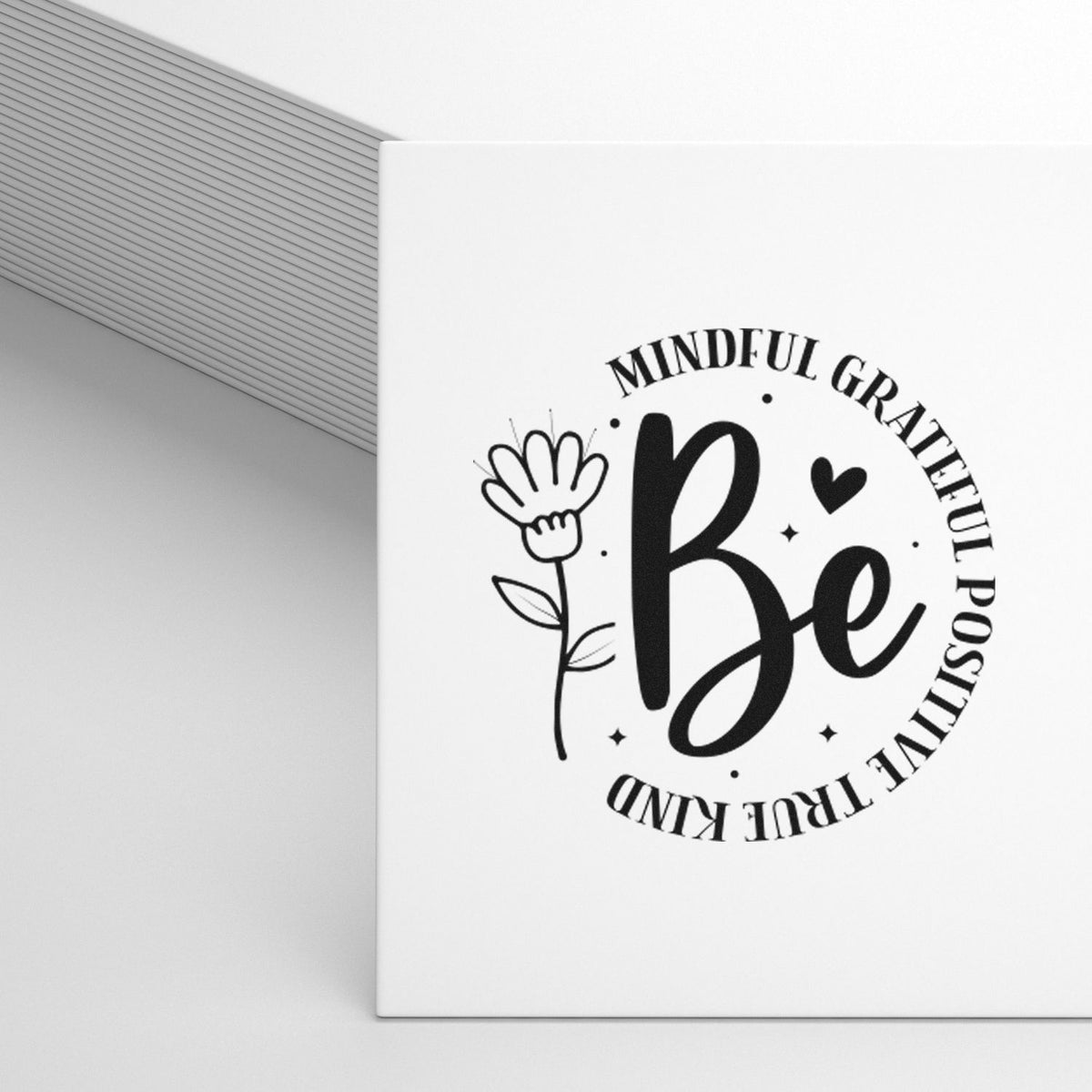 Motivational rubber stamp design with Be and Mindful, Grateful, Positive, True, Kind floral imprint on white paper.