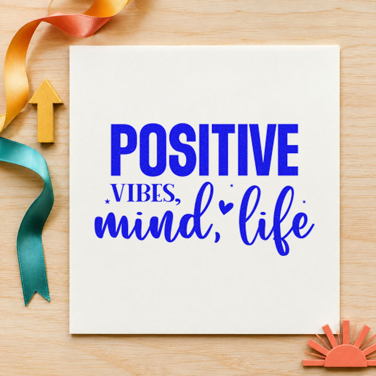 Positive Vibes Mind Life craft stamp imprinted in blue ink on paper, a design suited to framed order window.