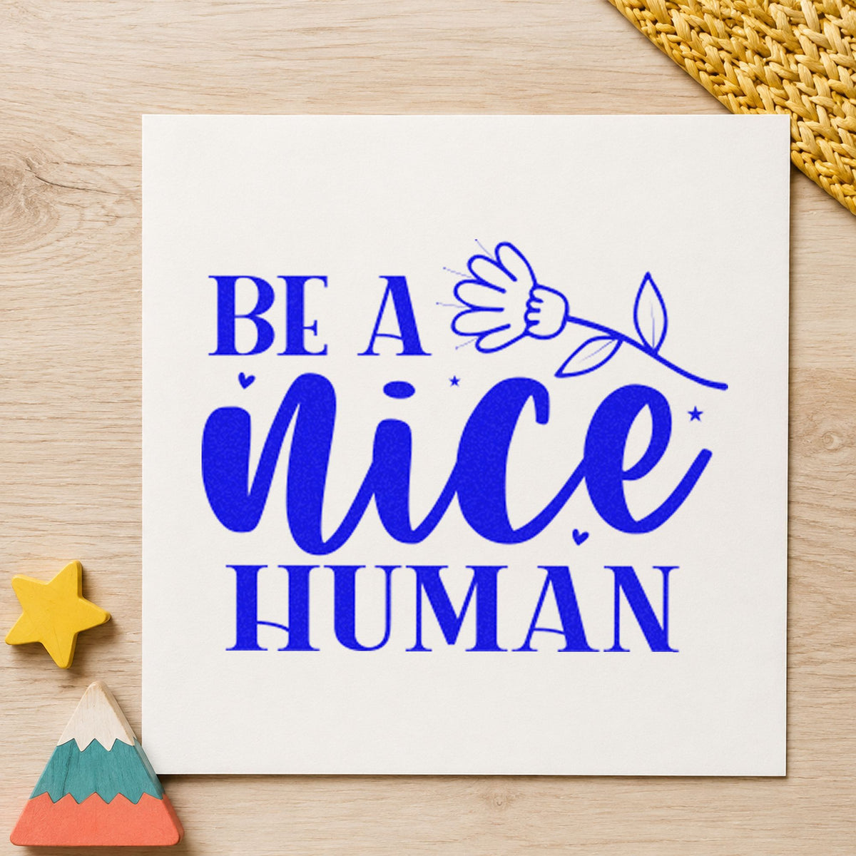 Be A Nice Human Flower craft stamp in blue ink on cardstock, an easy option for tool roll printing.