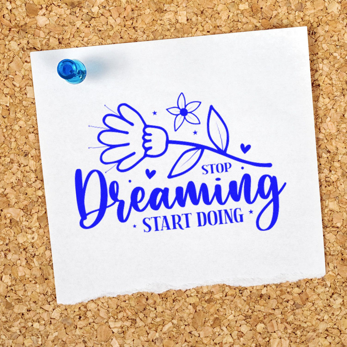 Motivational rubber stamp design with flower and hand reading Stop Dreaming, Start Doing on pinned paper.