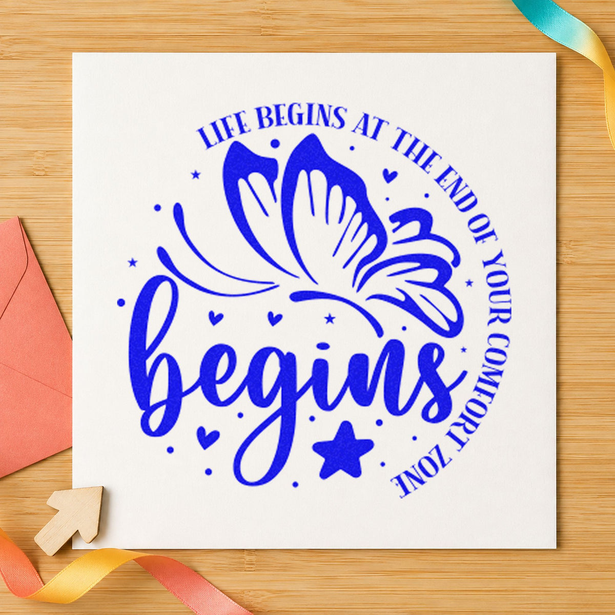 Life Begins Comfort Zone Butterfly craft stamp imprinted in blue ink on paper, a design suited to framed garage bay.
