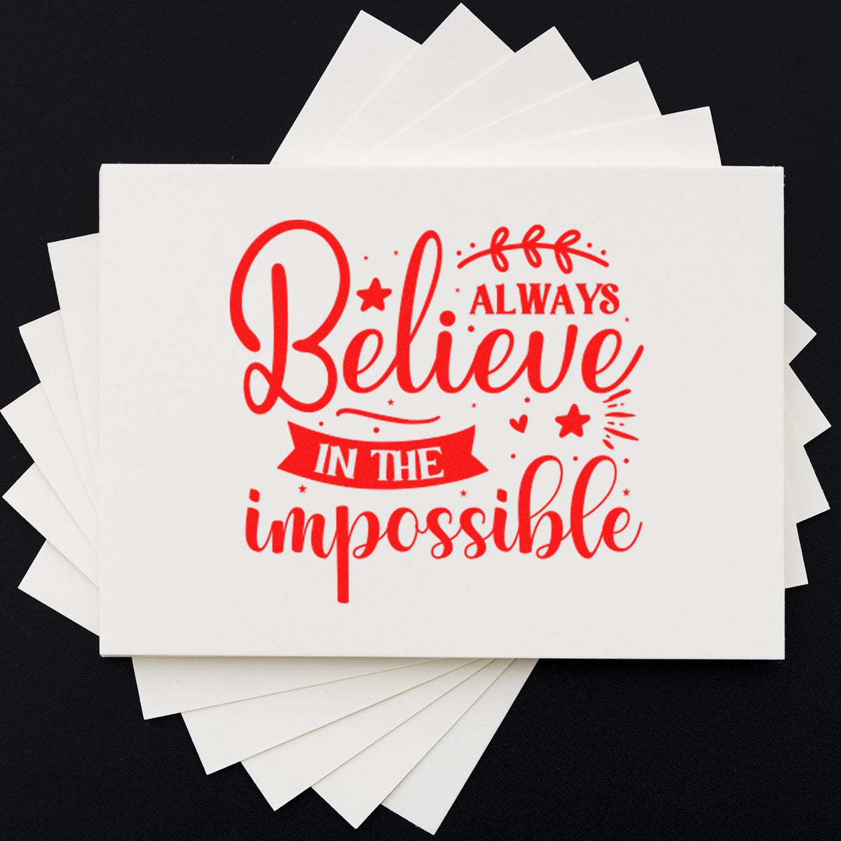 Believe in the Impossible rubber stamp design in red on white cardstock, ideal for inspirational crafting and custom stamping.