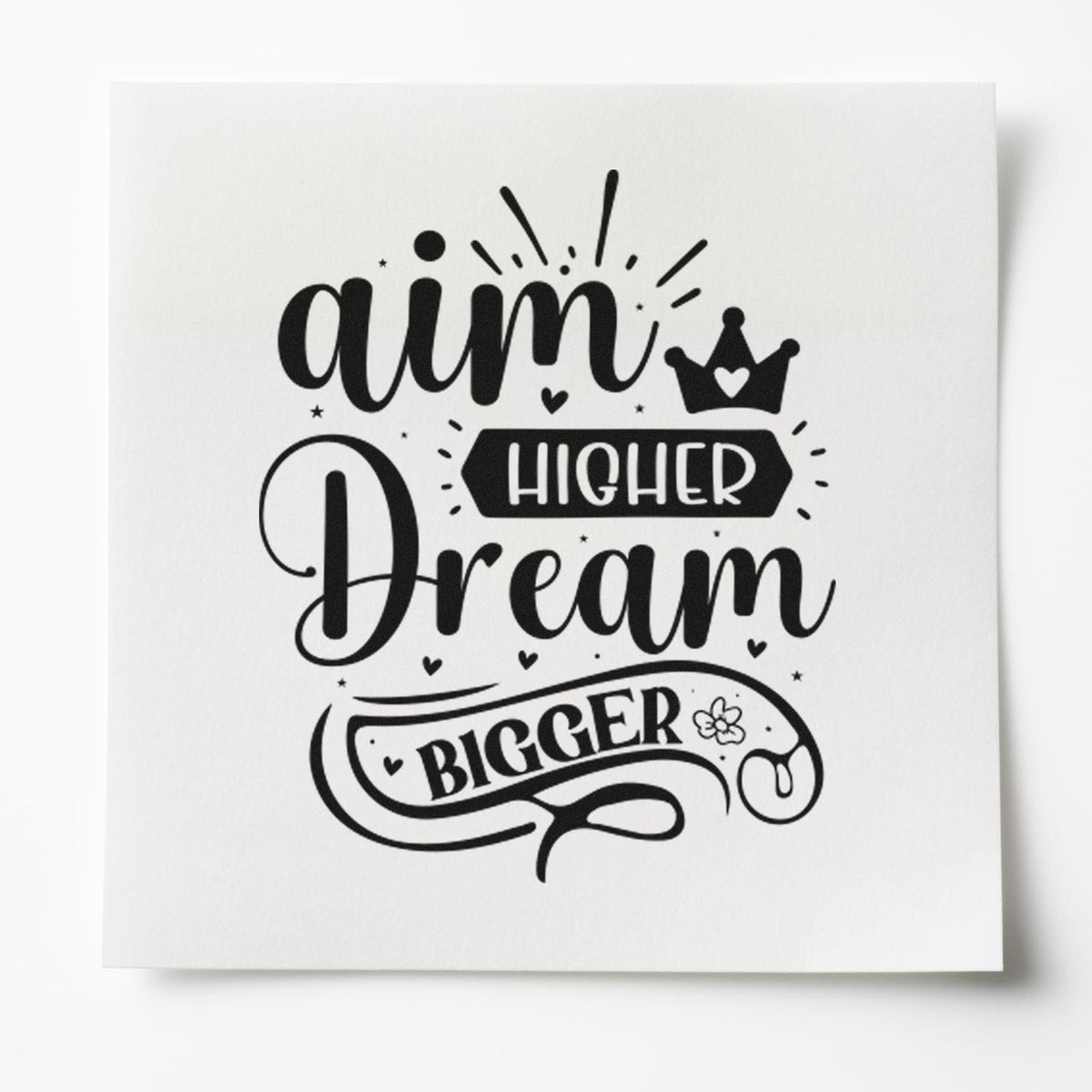 Motivational rubber stamp design with Aim Higher, Dream Bigger quote, crown icon, and bold decorative lettering.