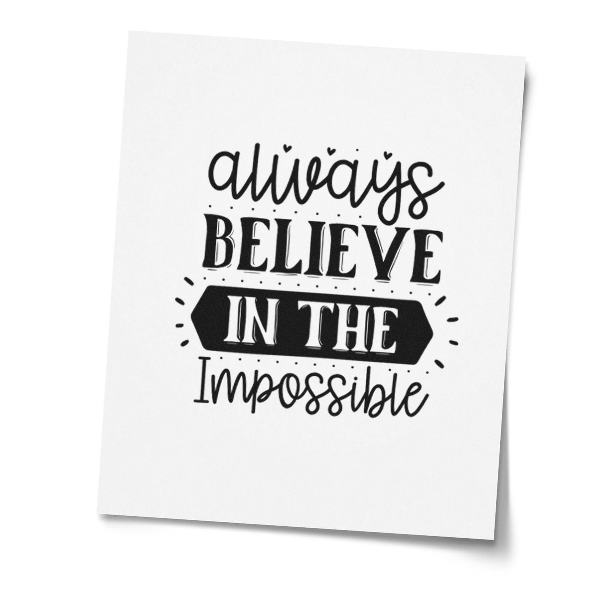 Always Believe in the Impossible inspirational rubber stamp design in bold black typography on white paper.