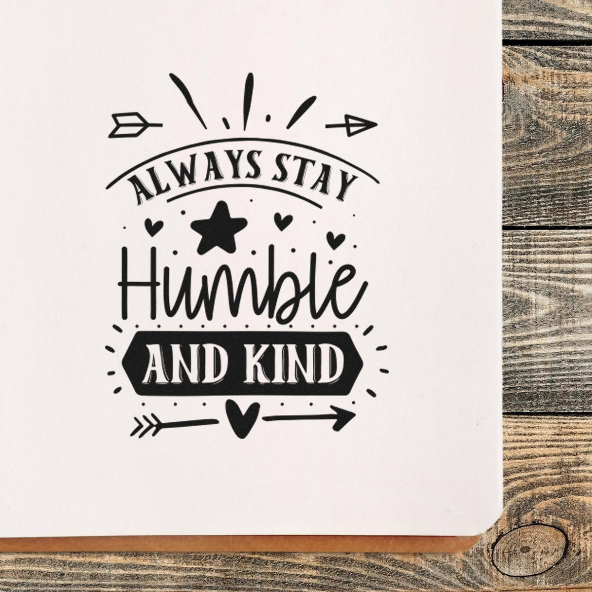 Inspirational rubber stamp design reading Always Stay Humble and Kind with hearts, star, and arrows.
