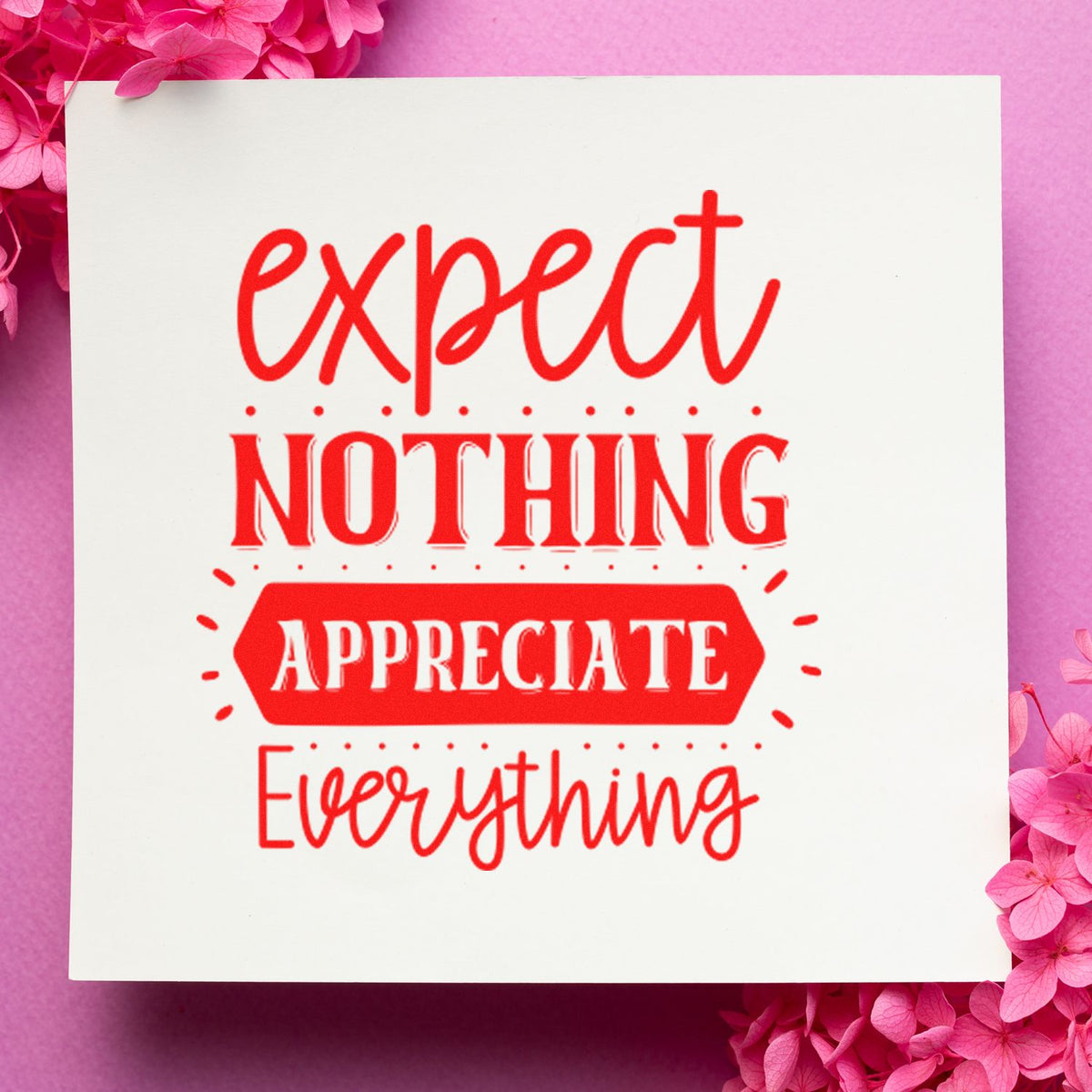 Decorative rubber stamp design with Expect Nothing, Appreciate Everything in red, ideal for handmade cards and craft projects.