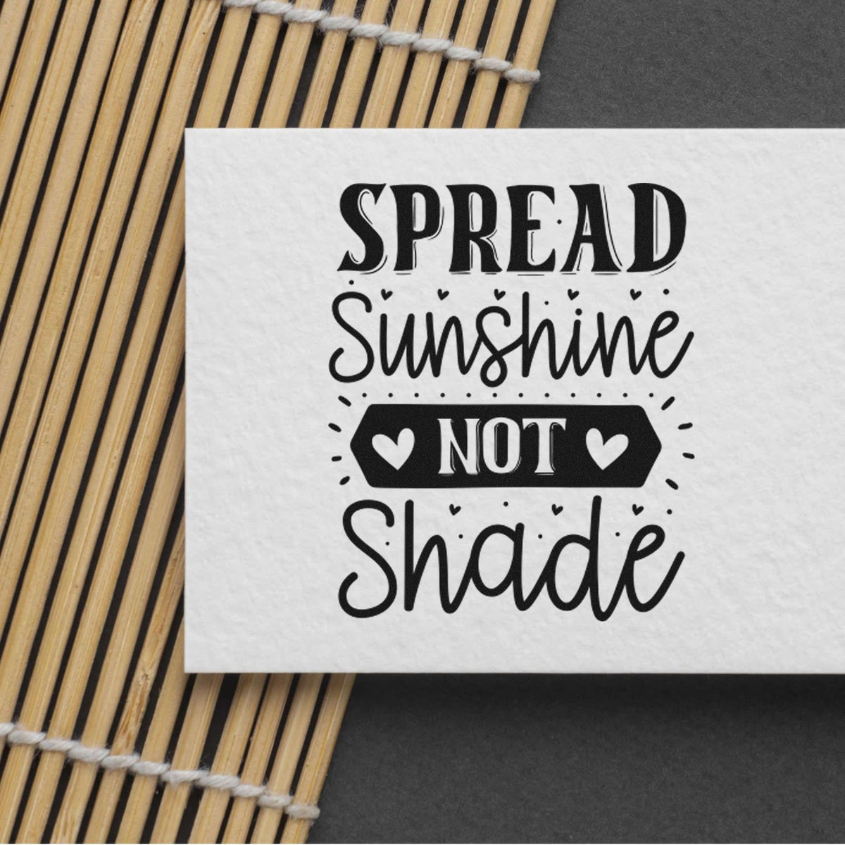 Custom rubber stamp quote design reading Spread Sunshine Not Shade with hearts, ideal for uplifting craft projects.