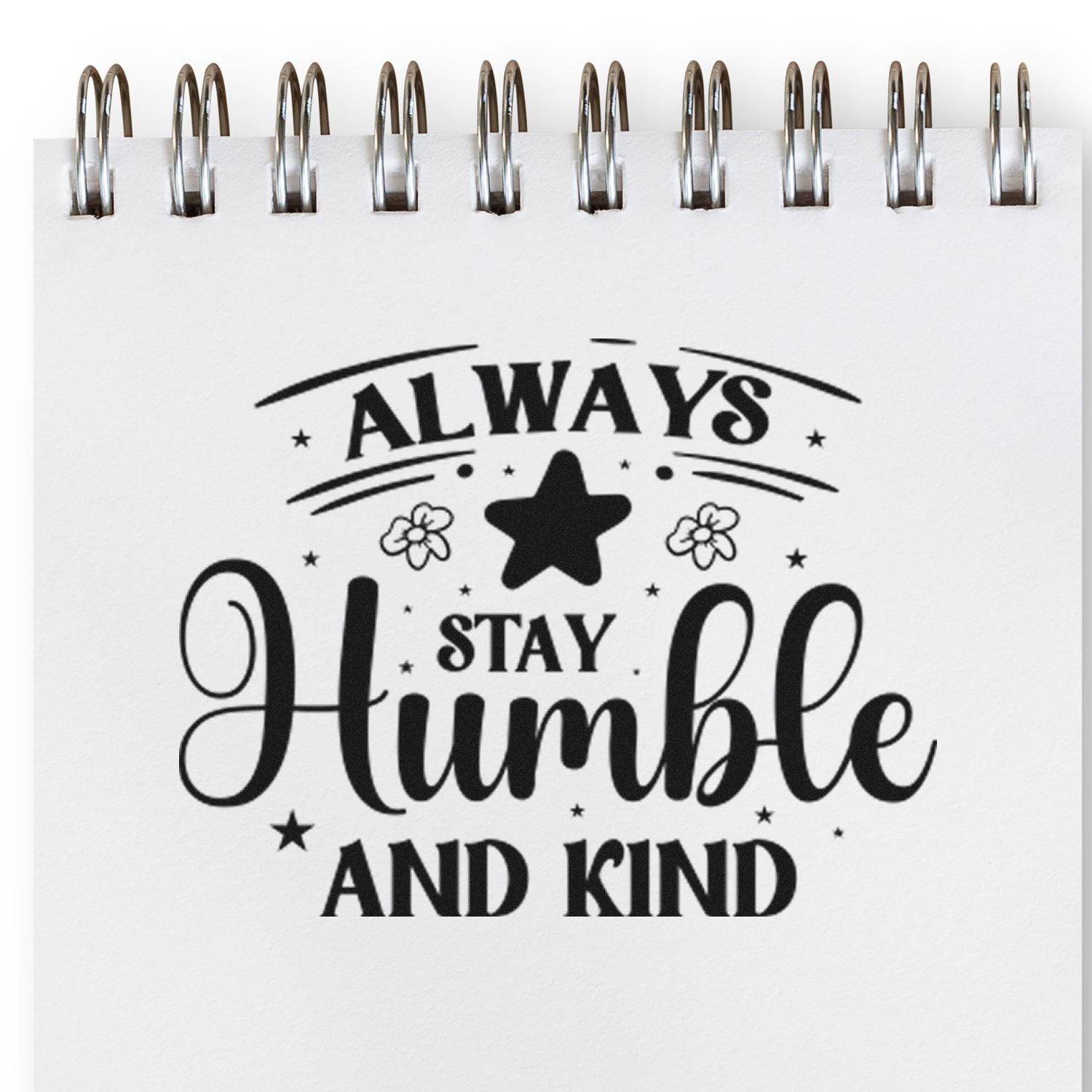 Always Stay Humble and Kind rubber stamp design with star accents on a spiral notebook page.