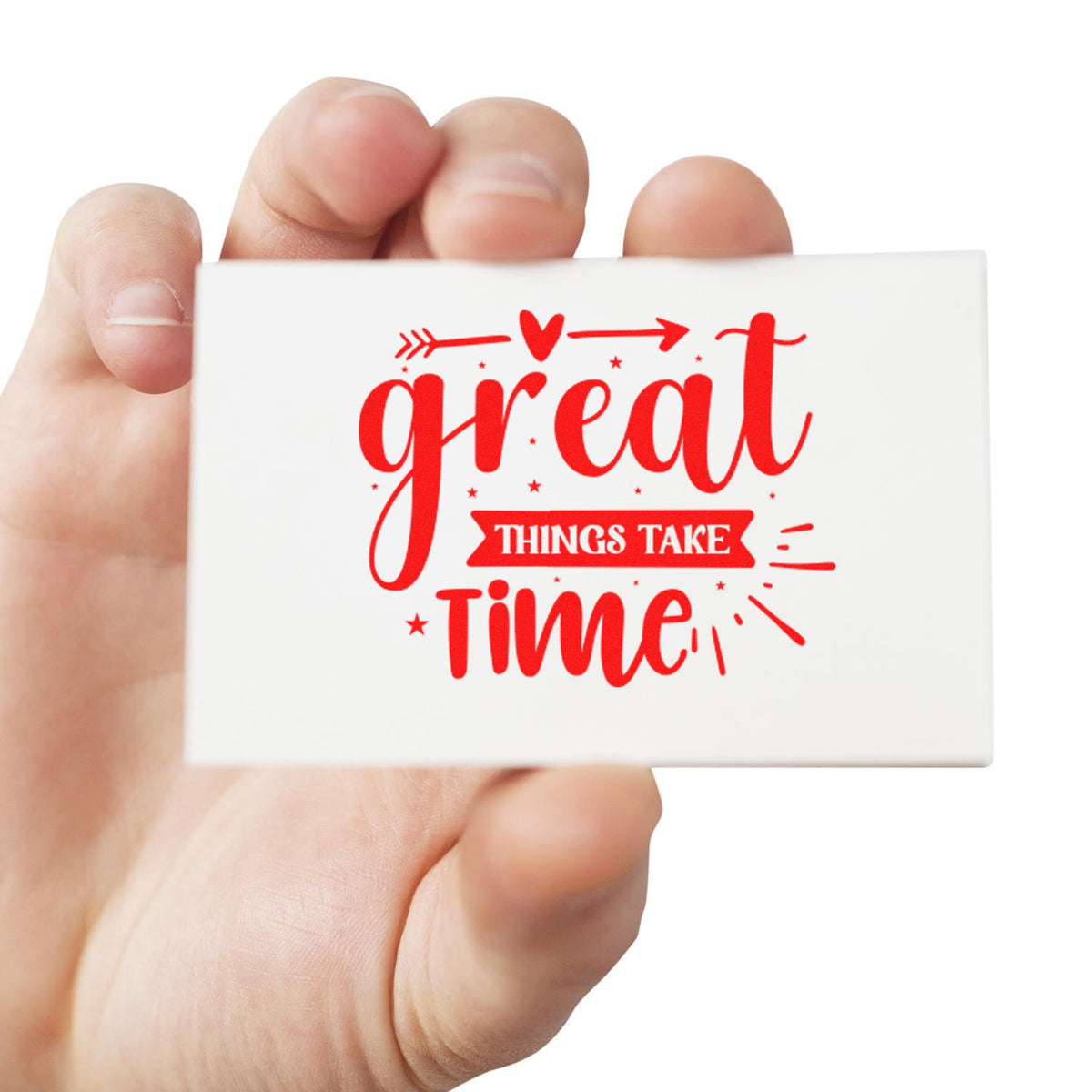 Hand holding a rubber stamp featuring Great things take time in red, a motivational quote for crafting and business use.