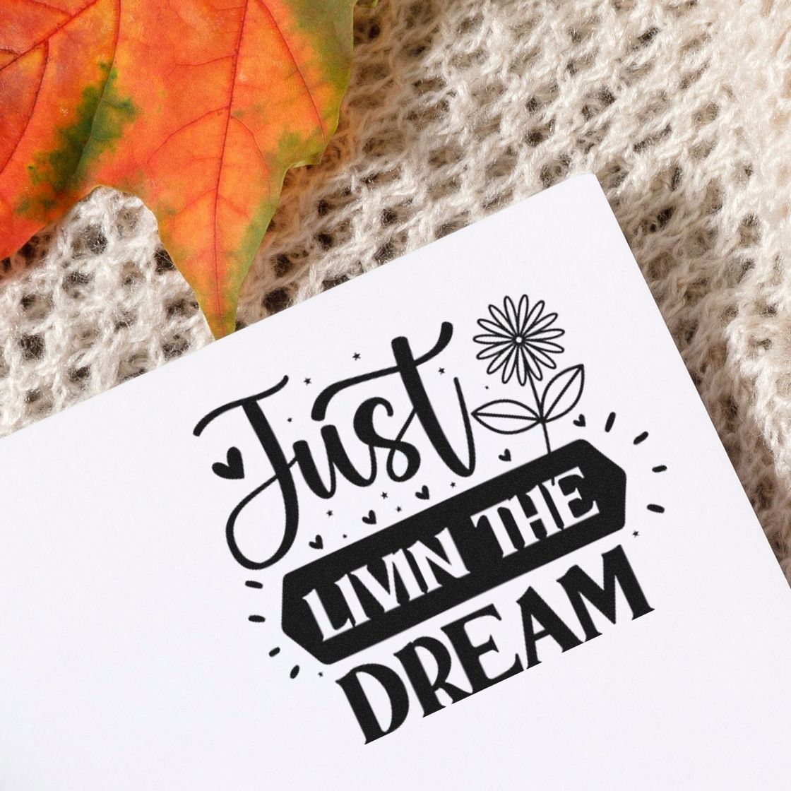Custom rubber stamp impression reading Just Livin the Dream with floral accents, ideal for handmade cards and journaling.