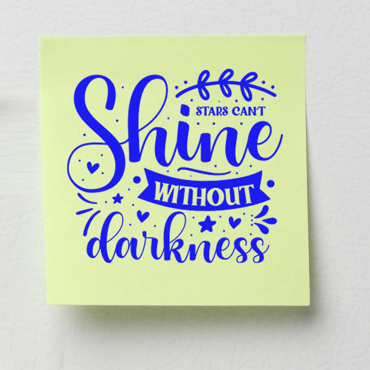 Custom rubber stamp design with inspirational quote Shine without darkness in blue on a sticky note.