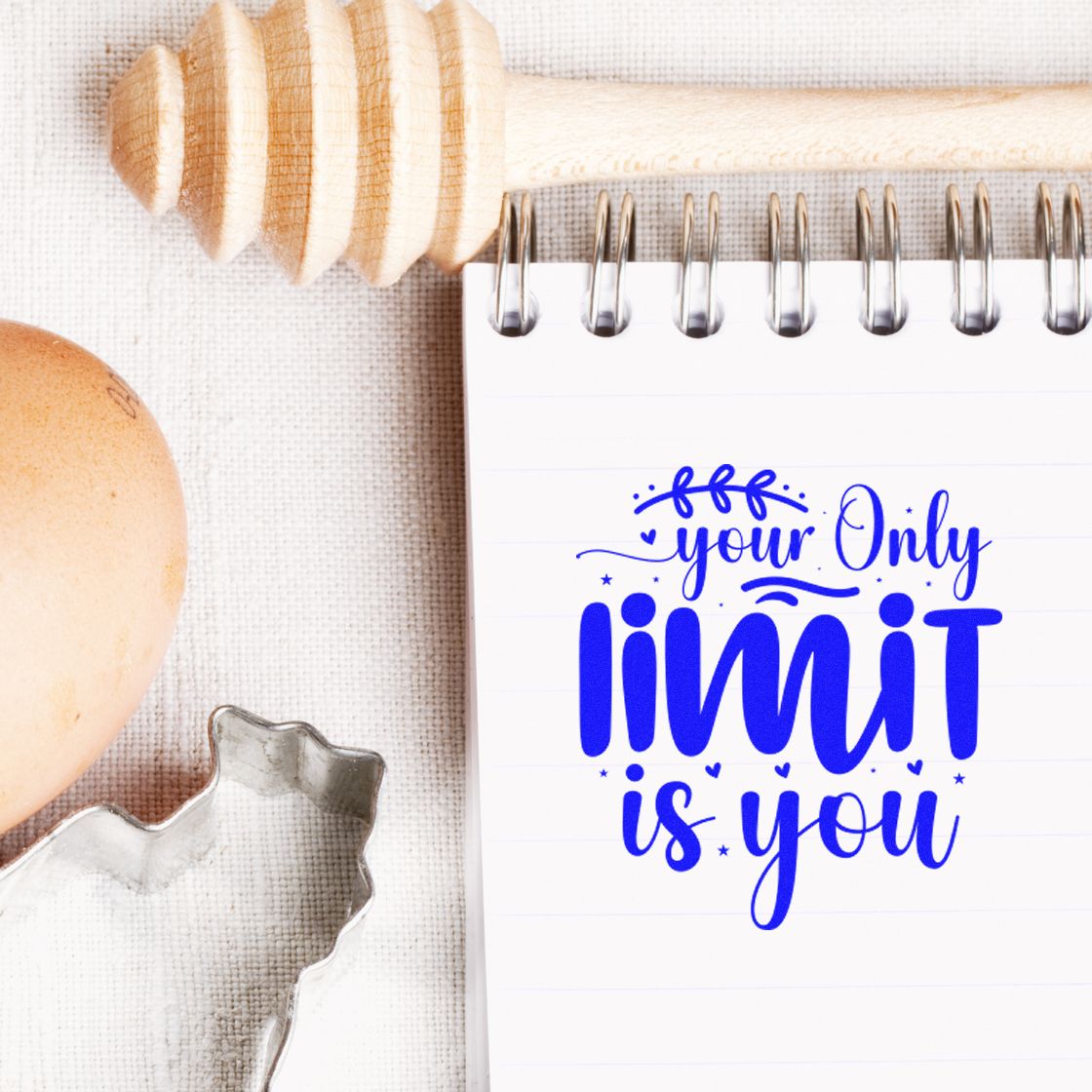 Custom rubber stamp design with inspirational quote your only limit is you on a notebook.