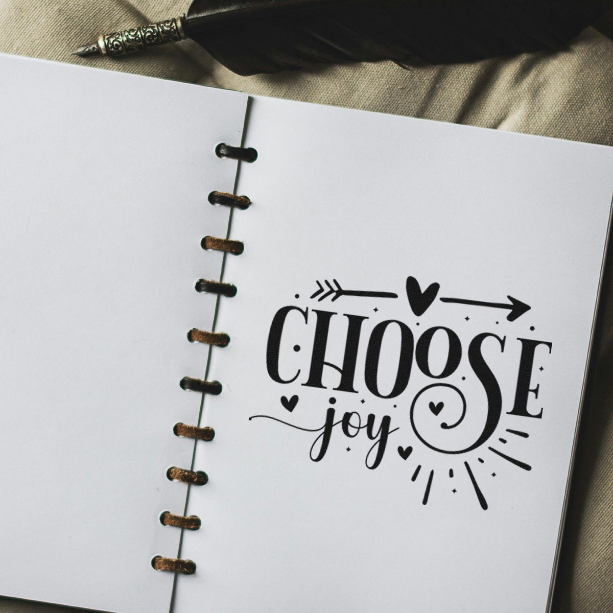 Choose Joy rubber stamp design on a notebook page, ideal for inspirational journaling, handmade cards, and paper crafting.