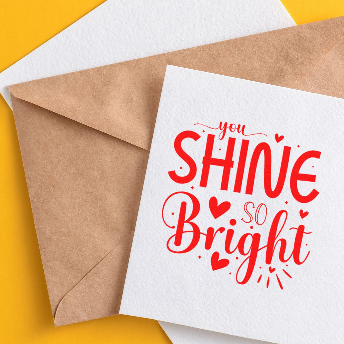 Handmade greeting card with red rubber stamp text, You Shine So Bright, for uplifting card making and craft projects.