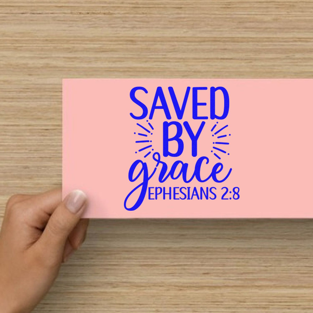Christian rubber stamp design reading Saved by Grace with Ephesians 2:8, ideal for faith-based cards and crafts.