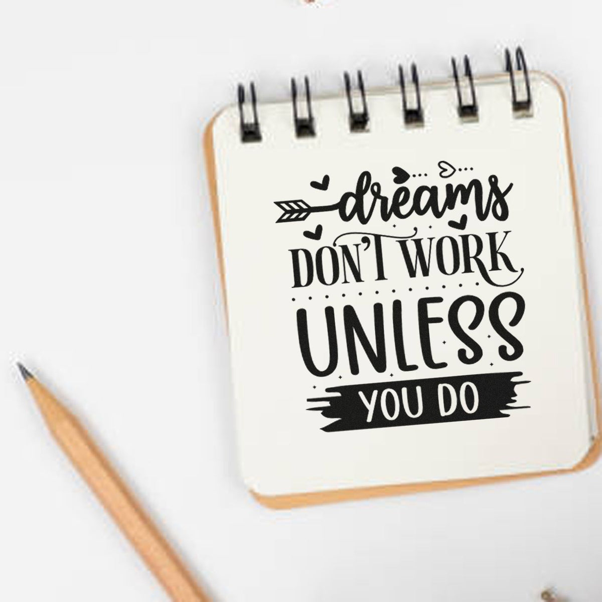 Inspirational rubber stamp design with Dreams dont work unless you do quote on notebook, ideal for planners and journaling.