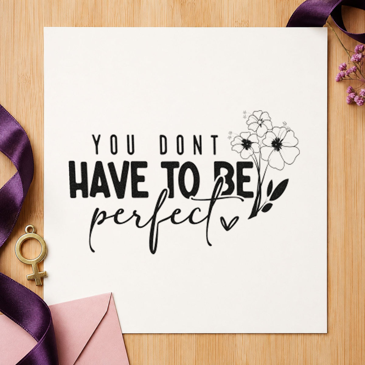 Don't Have To Be Perfect craft stamp imprint in black ink on a handmade project, one idea being seed packet tags.