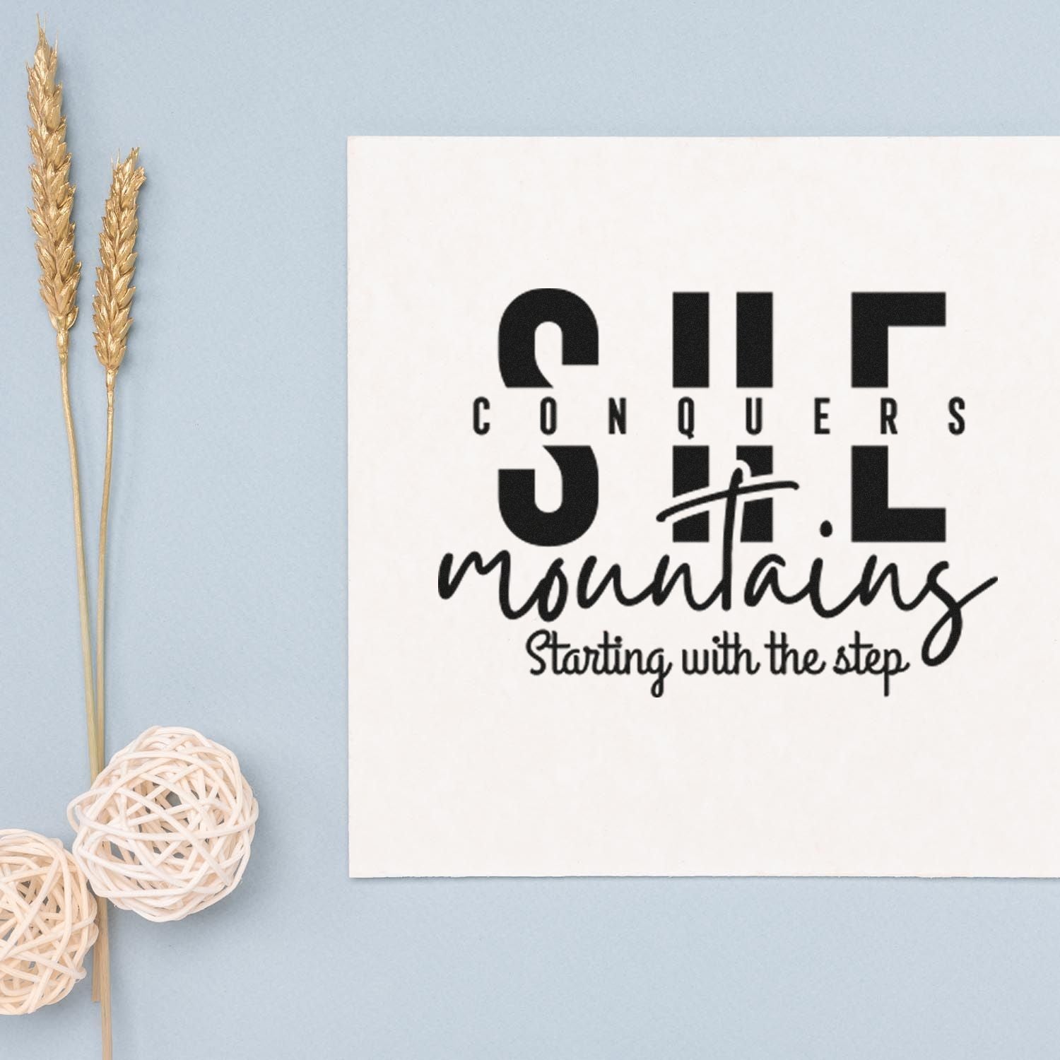 Motivational rubber stamp design reading She conquers mountains, starting with the step for handmade cards and crafts.